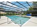 Inviting screened-in pool with ample seating, a hot tub, and a clean, modern design at 356 N Spaulding Cv, Lake Mary, FL 32746