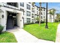 Attractive condominium entrance with well-maintained landscaping and exterior lighting at 4114 Breakview Dr # 30702, Orlando, FL 32819