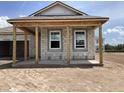This new home features an unfinished porch, and an open yard at 5706 Cattle Ranch Drive, St Cloud, FL 34771