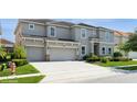 Attractive two-story home with a large driveway and well-maintained landscaping at 7017 Oakwood St, Davenport, FL 33837
