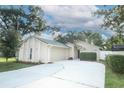 Well-maintained home with a two-car garage and a spacious driveway, perfect for Gathering living at 708 Wilson Rd, Winter Springs, FL 32708