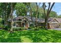 Charming home with lush lawn and mature trees providing shade and curb appeal at 920 Cool Springs Cir, Ocoee, FL 34761