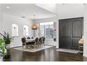 Spacious dining area featuring hardwood floors, modern light fixtures, and an open layout at 960 Brightwater Cir, Maitland, FL 32751