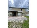Large covered patio with a brick-paved backyard, great for outdoor entertaining at 10337 Cypress Trail Dr, Orlando, FL 32825