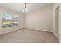 Neutral bedroom with vaulted ceiling, large window bringing in ample natural light, and neutral carpet at 1227 Juniper Hammock St, Winter Garden, FL 34787
