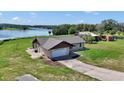 Charming single-Gathering home with a spacious driveway and lush green lawn at 16386 Se 156Th Place Rd, Weirsdale, FL 32195