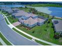 Aerial view of the house with a beautiful lake and surrounding area at 16768 Sanctuary Dr, Winter Garden, FL 34787
