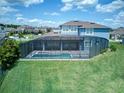 Aerial view of a screened-in backyard pool and patio area at 16768 Sanctuary Dr, Winter Garden, FL 34787