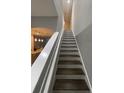 Staircase with white risers leading to the upper level at 2937 Econ Landing Blvd, Orlando, FL 32825