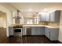 Bright kitchen with stainless steel appliances, sleek countertops, and modern cabinetry at 3443 Wild Myrtle Ct, Windermere, FL 34786