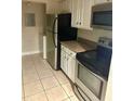 Functional kitchen with appliances, ample counter space, and plenty of cabinet storage at 3772 Idlebrook Cir # 100, Casselberry, FL 32707
