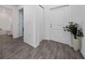 Inviting hallway with tile flooring, a coat closet and views of bathroom at 4990 Four Strand Ct, St Cloud, FL 34769