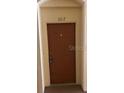 Image of a modern front door providing security and privacy for the unit at 8775 Sartori St # 307, Orlando, FL 32829