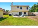 Spacious backyard with patio and green lawn perfect for outdoor living and entertaining at 879 Matt Ln, Port Orange, FL 32127