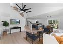 Open concept living room with high ceilings, modern decor, and a seamless flow to the kitchen and dining area at 9987 Triple Crown Cir, Orlando, FL 32825