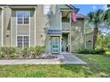 Welcoming exterior of home featuring classic siding, manicured landscaping, and a well-lit walkway at 3715 S Lake Orlando Pkwy # 11, Orlando, FL 32808