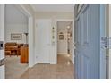 Inviting foyer featuring parquet wood flooring and a glimpse into the living spaces at 2040 Mohawk Trl, Maitland, FL 32751