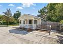 Inviting one-story home with a classic white picket fence, handicap access and front porch at 205 S Highland Ave, Apopka, FL 32703