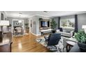 Comfortable living room with hardwood floors, large windows, and stylish furniture at 2109 Montana St, Orlando, FL 32803