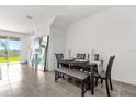 Dining room featuring an elegant table, comfortable seating, and neutral decor at 2224 Tay Wes Dr, St Cloud, FL 34771