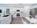 Bright kitchen features stainless steel appliances, ample counter space, and white cabinets at 2260 Suanee Ave, Eustis, FL 32726