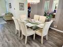 Stately dining area with seating for six and modern fixtures at 236 Boxwood Dr, Davenport, FL 33837