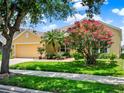 Beautiful home with lush landscaping and a well-maintained lawn at 2710 Gorst Rd, Winter Garden, FL 34787