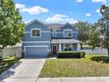 Charming two-story home with a well-manicured lawn and two car garage at 3259 Alling Ct, Deltona, FL 32725