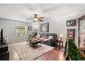Cozy living room with comfortable seating and natural light at 7466 Canford Ct # 25, Winter Park, FL 32792