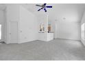 Spacious living room featuring plush carpeting, high ceilings, and lots of natural light at 10984 Pinewood Cove Ln, Orlando, FL 32817