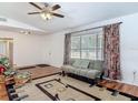 Inviting living room featuring a comfortable seating arrangement and natural light at 2203 Beatrice Dr, Orlando, FL 32810