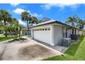 Two car garage on a single story home showing the air conditioner and duct work at 2391 Piedmont Lakes Blvd, Apopka, FL 32703