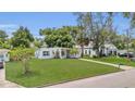 Beautifully landscaped front yard with a well-maintained lawn and easy street access at 2525 Lafayette Ave, Winter Park, FL 32789