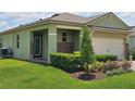 Attractive single-Gathering house with manicured lawn and shrubbery, and a brick-accented entry at 3371 Yellowtop Loop, Clermont, FL 34714