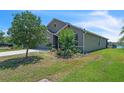 Charming single-story home with a well-maintained lawn and a neatly landscaped garden at 5234 Bear Corn Run, Port Orange, FL 32128
