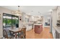 Bright eat-in kitchen boasts stainless steel appliances and a center island at 623 Tuskawilla Point Ln, Winter Springs, FL 32708