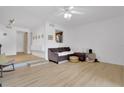 Bright living room with modern flooring, neutral walls, and an open layout to the kitchen at 758 E Michigan St # 203, Orlando, FL 32806