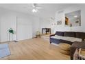 Bright living room with modern flooring, neutral walls, and an open layout to the dining area at 758 E Michigan St # 203, Orlando, FL 32806