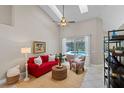 Bright living room with high ceilings, access to the pool area, and comfortable seating at 824 Spring Island Way, Orlando, FL 32828