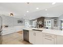 Modern kitchen boasts stainless appliances, white cabinets, and an open floor plan at 1327 Bridgeport Dr, Winter Park, FL 32789