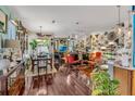 Bright, open living room area with sleek, dark floors and unique eclectic decor and furnishings at 14025 Oasis Springs Ln # 901, Windermere, FL 34786