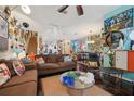 Open-concept living room with hardwood floors, comfortable seating, and artistic decor at 14025 Oasis Springs Ln # 901, Windermere, FL 34786