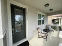 Inviting front porch with seating and a decorative front door at 14753 Snowy Egret St, Winter Garden, FL 34787