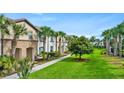 Well-manicured lawn and community landscaping add to the appeal of this townhome community at 1943 Majorca Dr, Kissimmee, FL 34747