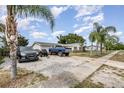 Long driveway leads to a one-story home with ample parking space for multiple vehicles at 1962 English Dr, Deltona, FL 32738