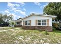Well-maintained single-story home with manicured lawn and lush landscaping at 1962 English Dr, Deltona, FL 32738