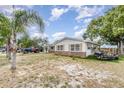 Spacious home with an attached garage and large yard, perfect for outdoor activities and entertaining at 1962 English Dr, Deltona, FL 32738