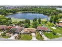 Aerial view of a charming neighborhood with lake access and lush greenery at 2028 Lake Christie Dr, Orlando, FL 32809