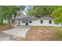 Bright one-story home with manicured lawn and new driveway at 22 Hillcrest Dr, Babson Park, FL 33827