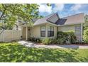 Inviting home exterior with sidewalk leading to the front door and landscaped yard at 2227 Doulton Dr, Orlando, FL 32812